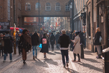 Brick lane street, London, England - February 3, 2019: Brick Lane is considered the heart of London's East End, and since the 1990s it has managed to become the alternative cultural center of London.のeditorial素材