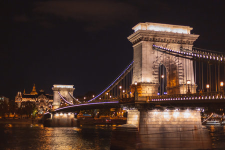Chain Bridge in Budapest seen at night with the lights onの写真素材