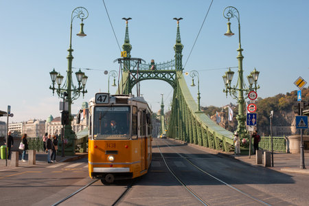 Budapest, Hungary-October 8, 2019: Tram numbre 49 circulating on the Liberty Bridge, in Budapest, Hungary.のeditorial素材