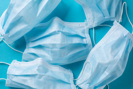 Surgical mask isolated on blue backgroundの写真素材
