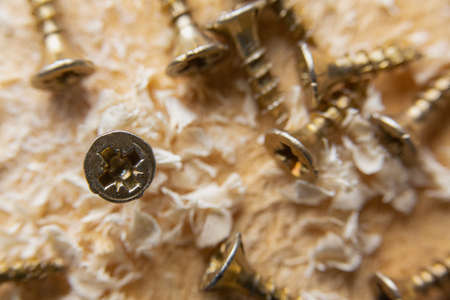 Close up wood threaded lag screw and two hand screwdriversの写真素材
