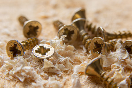 Close up wood threaded lag screw and two hand screwdriversの写真素材