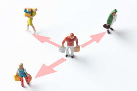 miniature people figures on white background with safety distance marked on the groundの写真素材