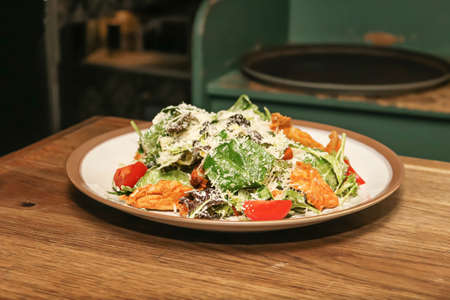 very tasty salad in a big plate on the table in you homeの写真素材