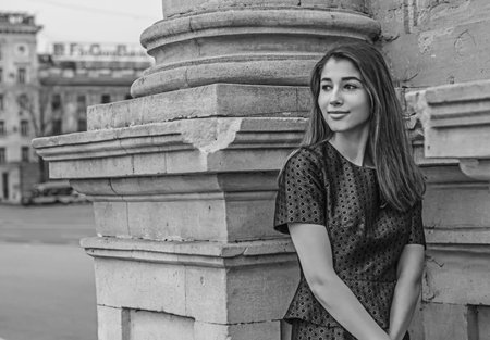a beautiful girl walking in big city