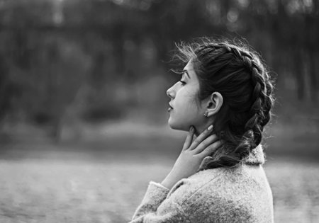 a beautiful woman playing in park at sunny day
