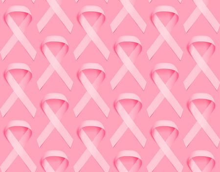 Realistic pink ribbon seamless background template, breast cancer awareness symbol. Breast cancer awareness pink ribbon.のイラスト素材