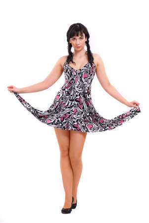 A brunette is in a short dressの写真素材
