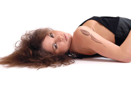 Beautiful girl with a tattoo on a white backgroundの写真素材