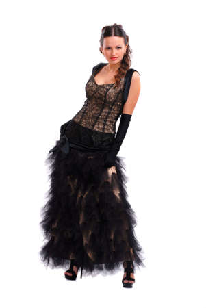 Beautiful young girl in a black dress on a white backgroundの写真素材
