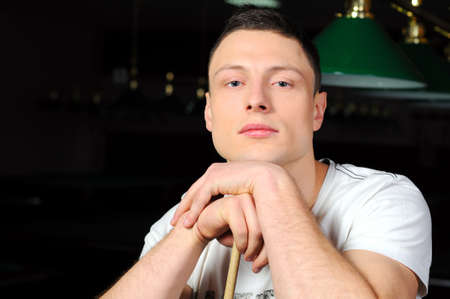 Portrait of a young man playing snookerの写真素材
