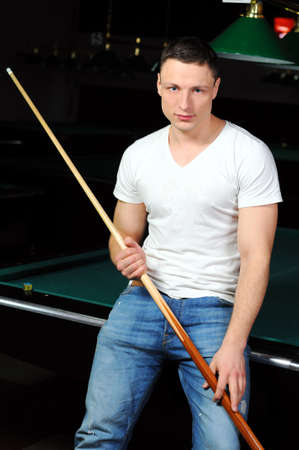 Portrait of a young man playing snookerの写真素材