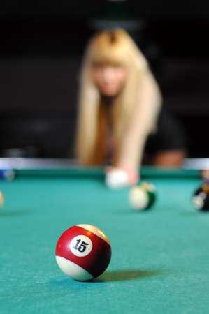 Young girl playing snookerの写真素材