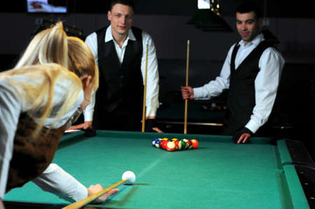 Group of young professionals, playing snookerの写真素材