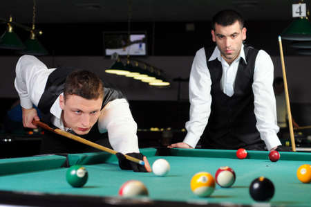 young professional people play snookerの写真素材