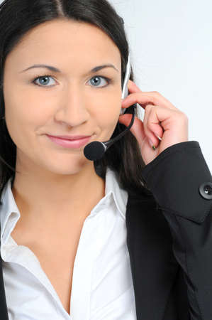 Woman operator with headset on white backgroundの写真素材