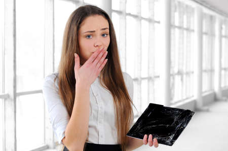 young business girl broke the tabletの写真素材