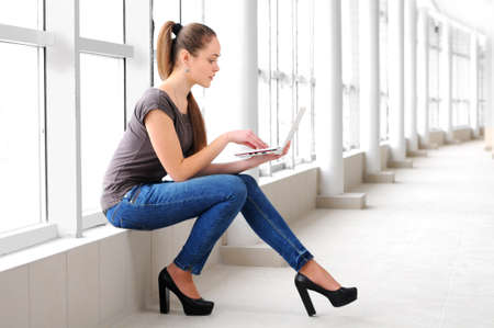 Young girl with laptopの写真素材
