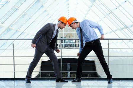Two men in hard hats at construction siteの写真素材