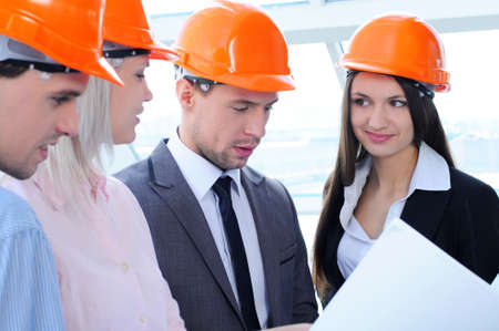 People in helmets on a construction siteの写真素材