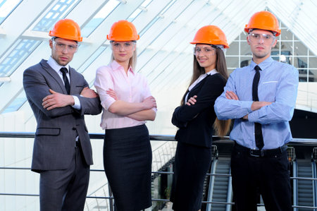 People in helmets on a construction site