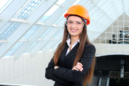 Portrait of a beautiful business woman on background of modern buildingの写真素材