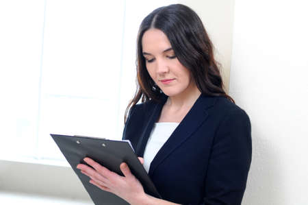 Face of beautiful business woman on the background of business peopleの写真素材