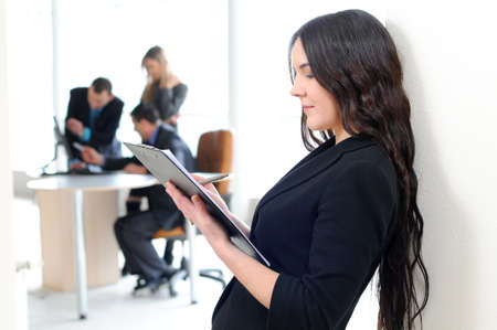 Face of beautiful business woman on the background of business peopleの写真素材