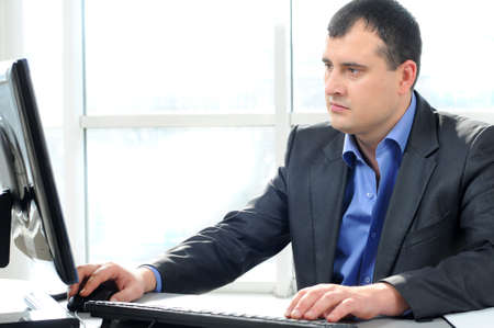 businessman working in office on computerの写真素材