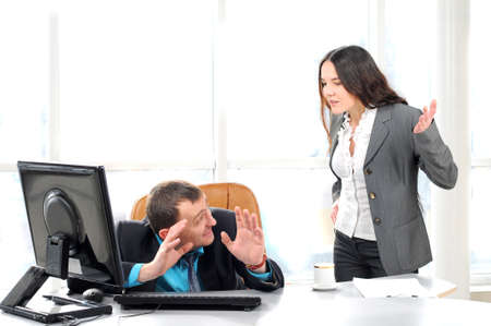 Boss blaming an employee in the officeの写真素材