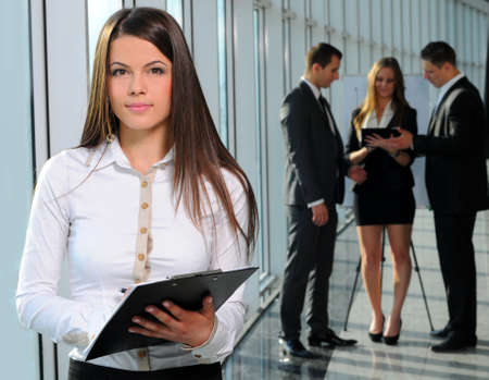 beautiful business woman on the background of business peopleの写真素材