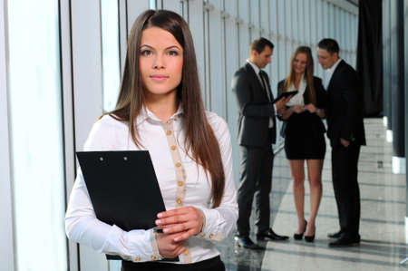 beautiful business woman on the background of business peopleの写真素材