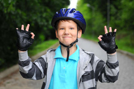 Portrait of a cute boy on bicycleの写真素材
