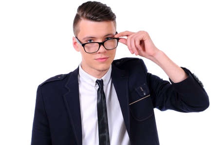 Young handsome man in black suit and glasses smiling isolated on white backgroundの写真素材
