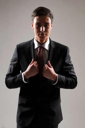 Portrait of successful business man, on black backgroundの写真素材