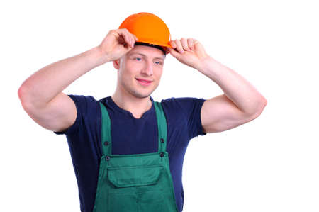 Tired man in a construction helmet on a white background の写真素材