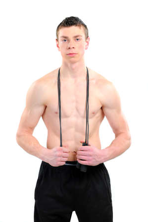 Image of young handsome athlete with skip ropeの写真素材