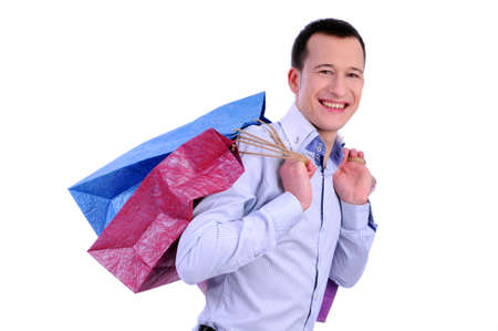 man with bags for shopping on a white backgroundの写真素材