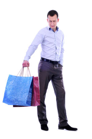 man with bags for shopping on a white backgroundの写真素材