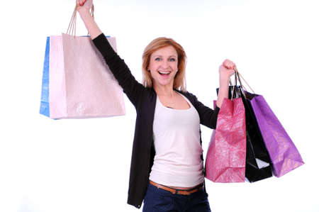 lovely woman with shopping bags over white backgroundの写真素材