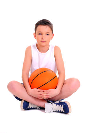 child with basketball, isolated on white backgroundの写真素材