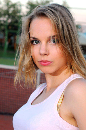 Pretty sportswoman at the tennis court  Healthy lifestyleの写真素材