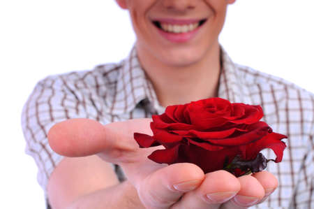 young boy with a flower in your handの写真素材