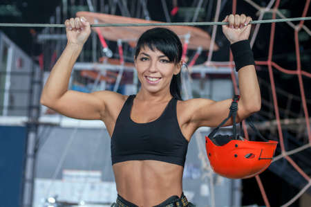 Portrait of a young beautiful girl. Climbing the wall.の写真素材