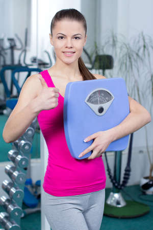 Fitness Woman. Female hesitate to weight. meet their achievementの写真素材