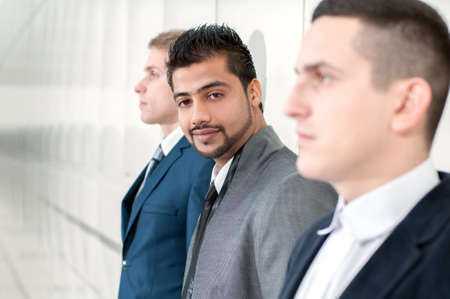 Group of young cheerful business people in business buildingの写真素材