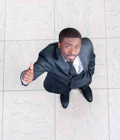 Above view of a successful businessman showing OK Sign. Top Viewの写真素材