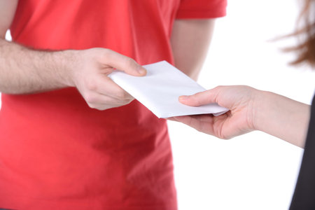A postman delivering mail isolated on white background