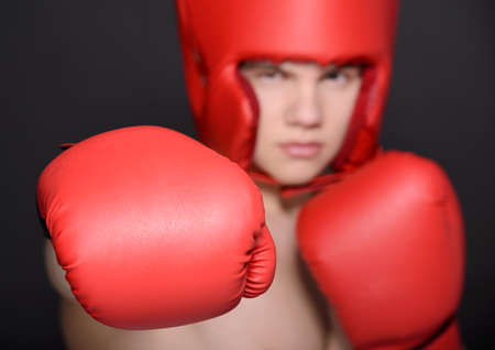 Young handsome boxer man isolated on black backgroundの写真素材