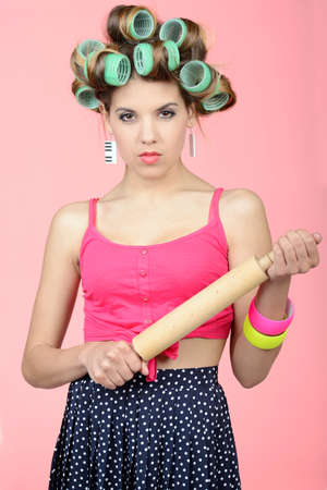 So, where have you been? Sexy young housewife standing with a rolling pin in her handの写真素材